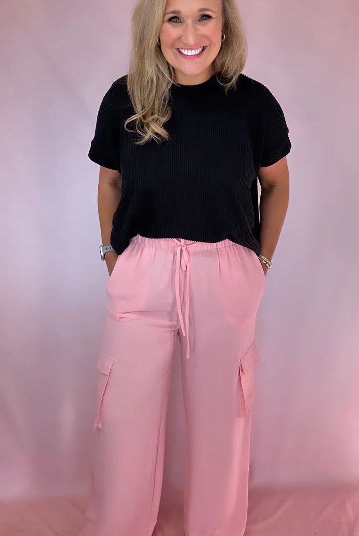 Girl Wearing Pink Cargo Pants with Pockets | Podos Boutique