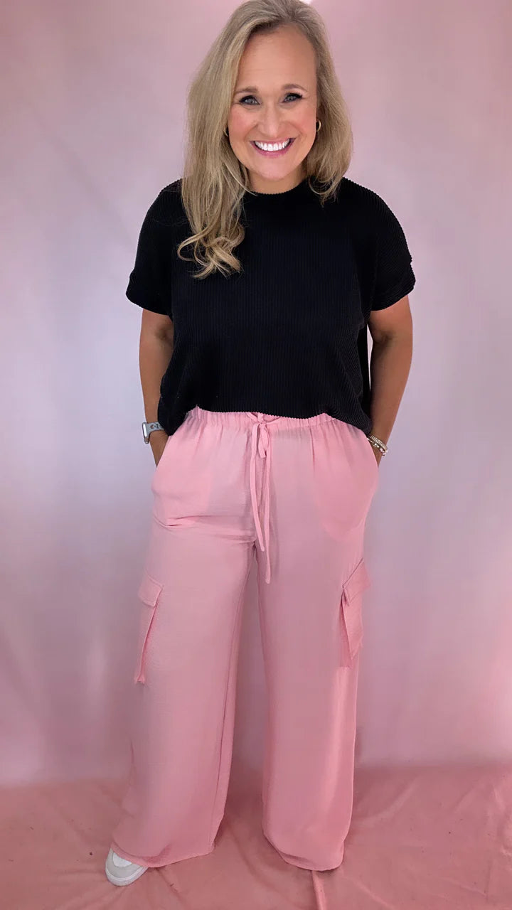 Girl Wearing Pink Cargo Pants with Pockets | Podos Boutique
