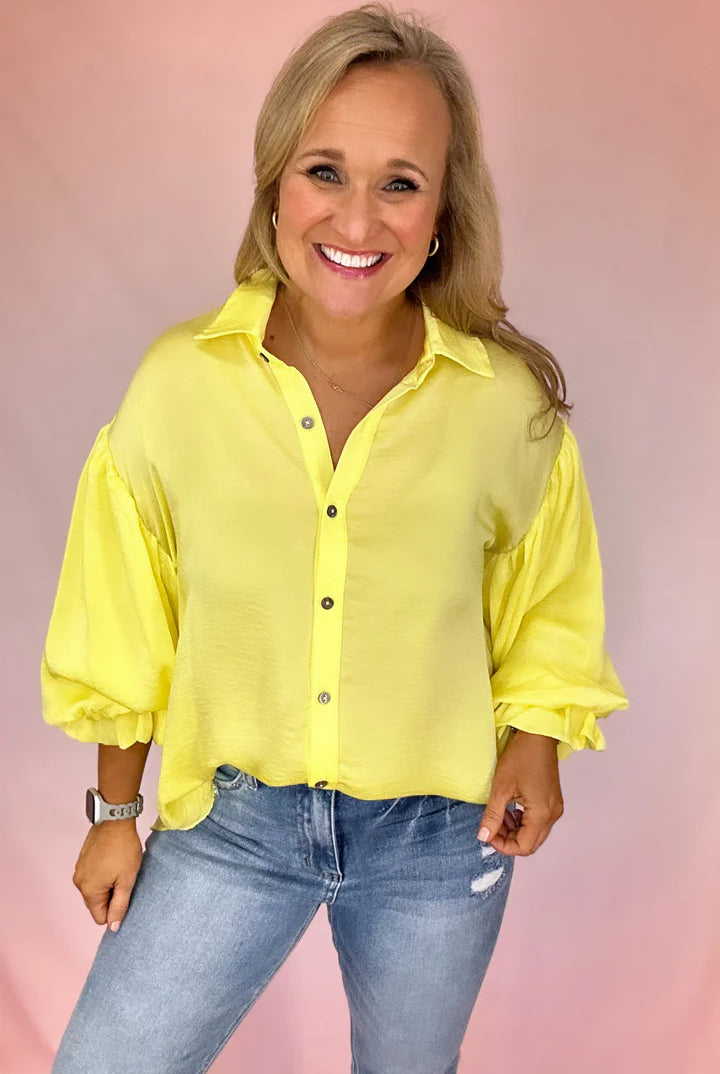 Girl Wearing A Long Puff Sleeve Yellow Button Up Top | Podos Boutique